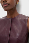 Plum Stamped Faux Leather Duke Top: A classic, sleeveless faux-leather blouse with crocodile texture, embodying effortless elegance and fun style, perfect for high-end, versatile looks.