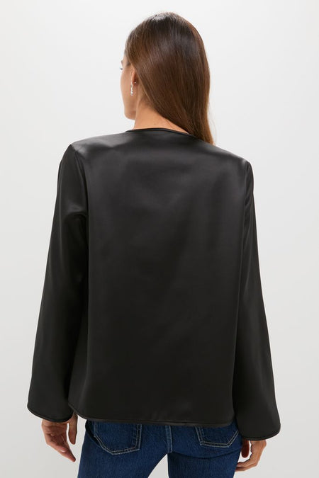 Model in classic Black Satin Tatiana Blouse with a chic finish, paired with denim jeans, showcasing an effortless, high-end look perfect for day-to-night occasions.