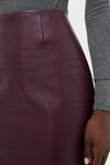 Plum Stamped Faux Leather Ellington Skirt offers a classic, high-end look with its croc-embossed design, effortlessly paired with a ribbed gray top for fun versatility.