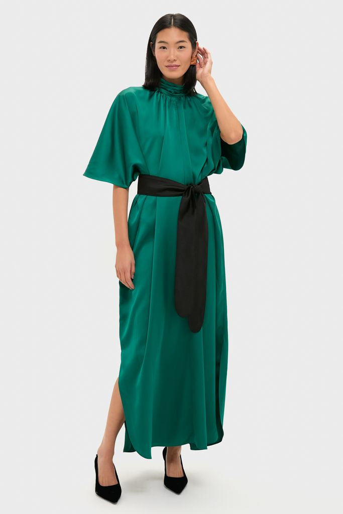 Green Satin Patricia Maxi Dress: A classic, high-end satin dress with a mock neck, bell sleeves, and removable tie belt, offering an effortless, fun, and elegant silhouette.