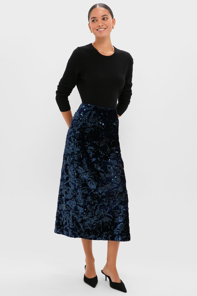 Velvet and Sequin Maloney Midi Skirt: A classic, effortless high-end piece with a chic column silhouette and subtle shimmer, perfect for fun cocktail events and holiday gatherings.