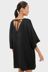 Black Satin Diane Mini Dress featuring a classic, effortless silhouette with a V-shaped back and kimono sleeves. Perfect for fun, high-end events.