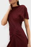 Black Cherry Dena Midi Dress with classic ruched detailing and an asymmetrical neckline, embodying effortless high-end style for any fun, special occasion.
