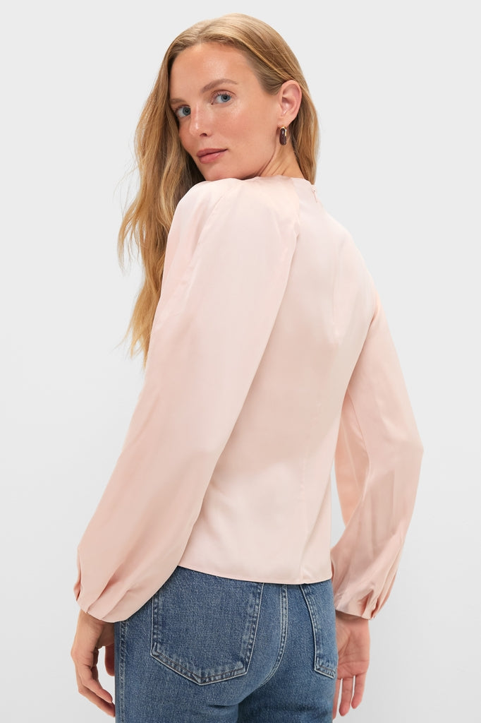 Model wearing the Soft Pink Blush Satin Blaire Top, showcasing its classic, effortless elegance with delicate gathering and blouson sleeves, embodying a high-end, fun style.