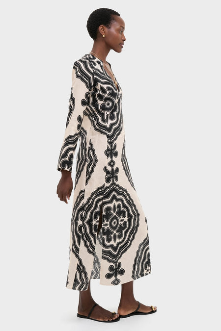 Niku Cream Theodora Column Dress: Classic and effortless, this high-end maxi dress features bold motifs, a V-neck, and bell sleeves, creating a chic, bohemian silhouette.