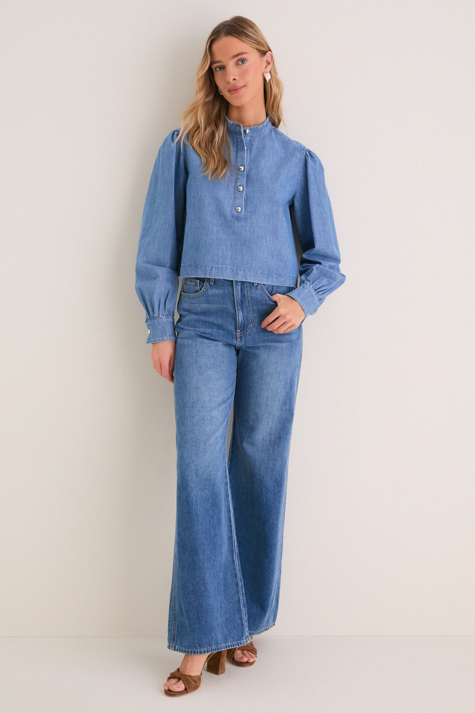 Indigo Denim Margot Top: Classic, effortless style with a rounded collar and gold hammered buttons, paired with matching denim jeans for a fun, high-end look.