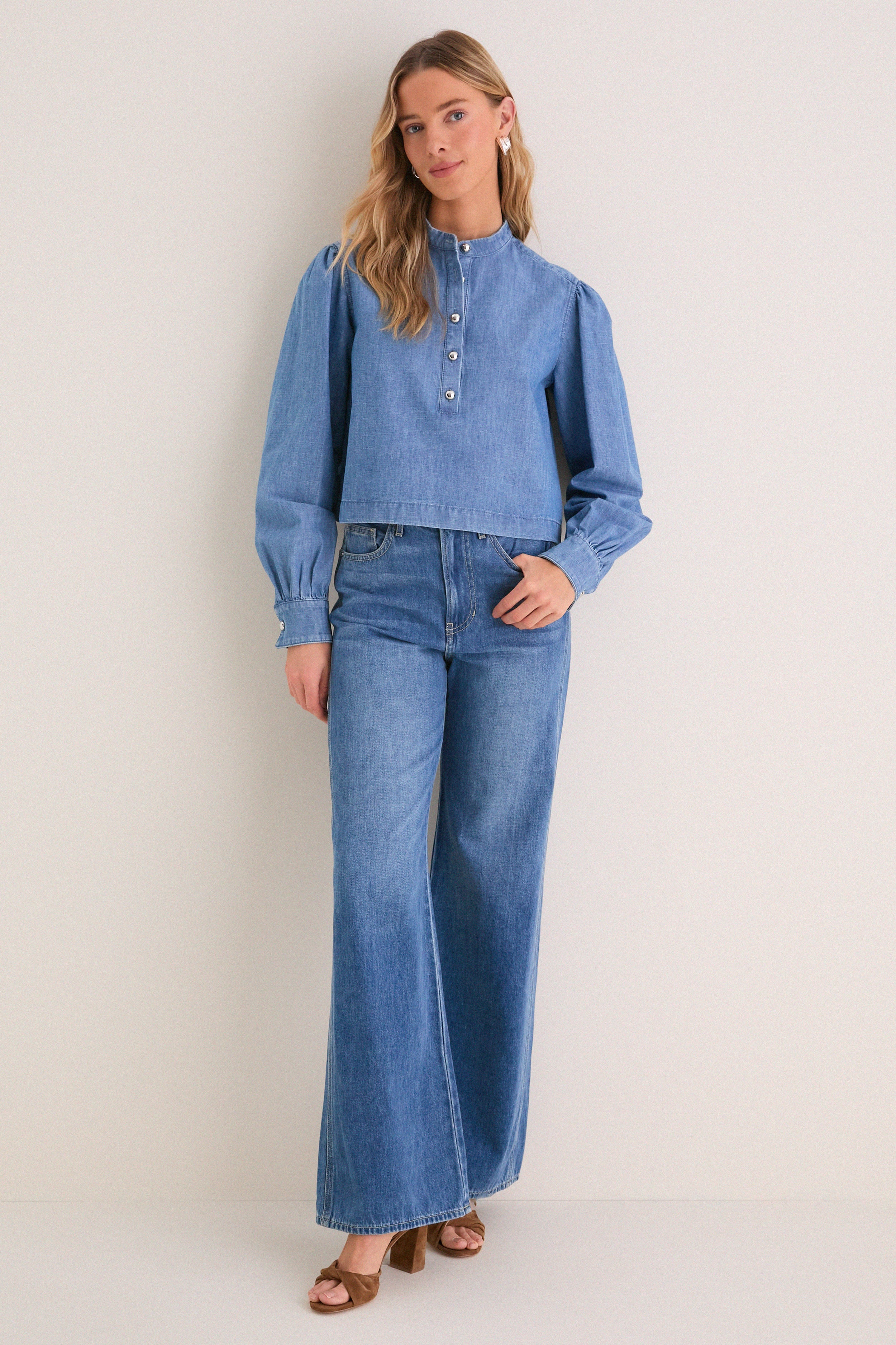 Indigo Denim Margot Top: Classic, effortless style with a rounded collar and gold hammered buttons, paired with matching denim jeans for a fun, high-end look.