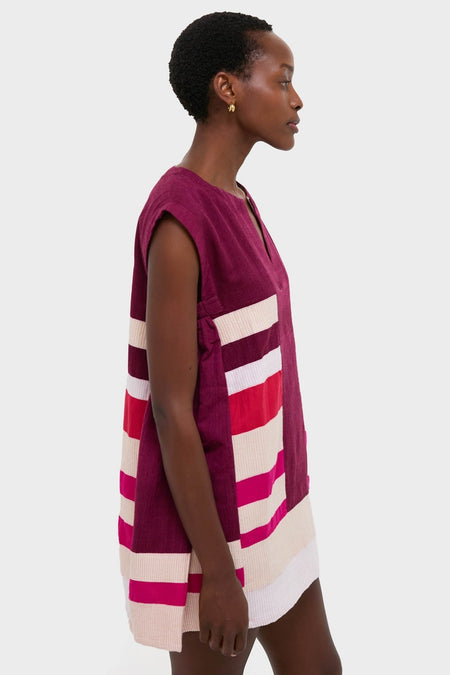 Betami Cherry Elina Caftan: A classic, sleeveless, A-line dress with bold stripes, offering an effortless, fun, high-end look for versatile, confident vacation styling.