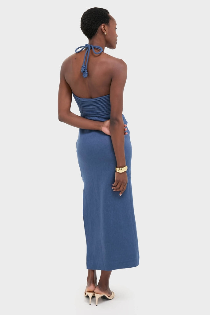 Model in Indigo Mezcalitos Midi Dress: classic, effortless, high-end linen with halter neck, braided detailing, and side slit. Perfect for fun, confident outings.