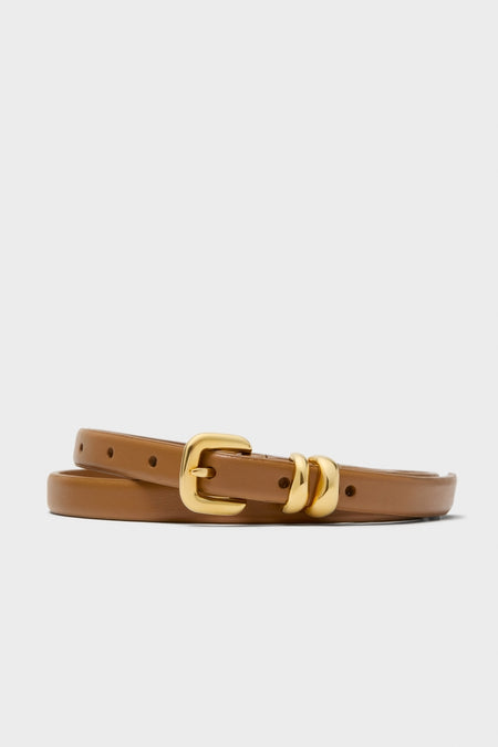 Saddle Hip to Waist Skinny Belt, a classic and effortless tan leather accessory with a high-end polished gold-tone buckle and loops, perfect for fun, confident styling.
