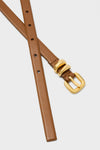 Saddle Hip to Waist Skinny Belt with a classic gold-tone buckle and loops, offering effortless style and fun versatility for high-end accessorizing.