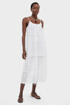Effortlessly elegant, the Abira White Nia Slip Dress features classic spaghetti straps, a relaxed fit, and shimmering details, perfect for a fun, high-end summer look.