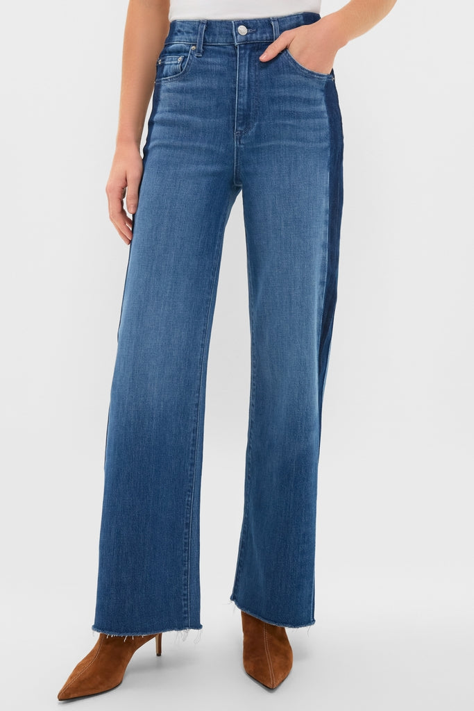 Model wearing American Dream High Rise Column Jean with classic five-pocket styling, effortless dual-tone design, and fun raw hem, paired with suede boots for a high-end look.