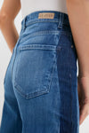 Close-up of American Dream High Rise Column Jean's back, featuring a classic two-tone design with a leather-look label and effortless style.