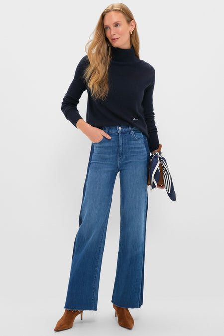 Woman models American Dream High Rise Column Jean with classic high-rise waist, dual-tone wide-leg, styled effortlessly with a dark turtleneck and suede ankle boots for a high-end, fun look.