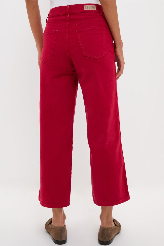 Model showcases classic Red Juliette High Rise Wideleg Ankle jeans, effortlessly styled with brown suede loafers, highlighting high-end, fitted design through hips, perfect for any occasion.