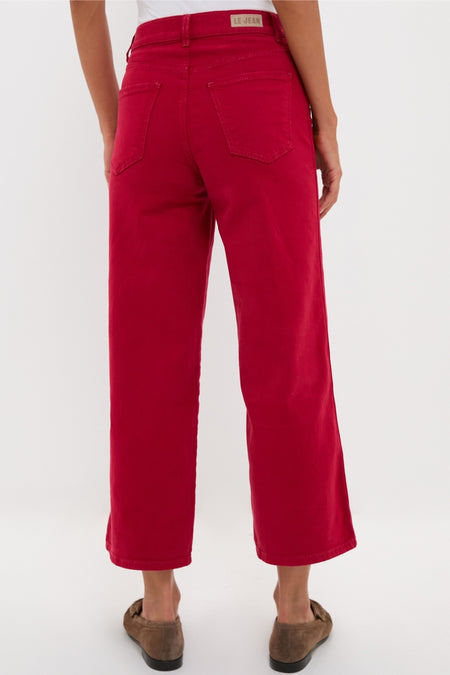 Model showcases classic Red Juliette High Rise Wideleg Ankle jeans, effortlessly styled with brown suede loafers, highlighting high-end, fitted design through hips, perfect for any occasion.