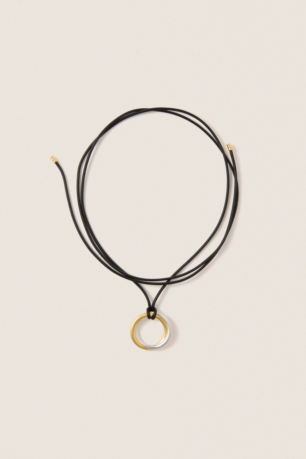 Mixed Lucy Williams Entwine Pendant Cord Necklace features a classic, effortless design with two-tone rings on an adjustable black cord, offering a fun, high-end look.