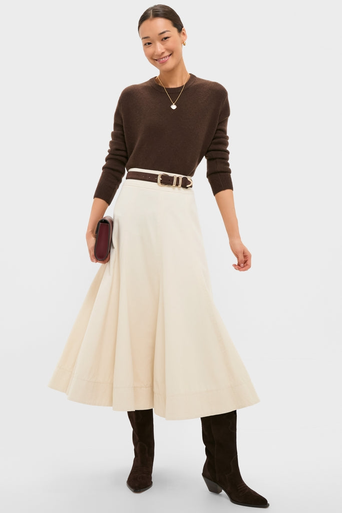 Woman in a smart-casual outfit featuring a classic Gold Lucy Williams Engravable Fortuna Arc Coin Pendant Necklace, embodying an effortless, high-end style with fun, understated elegance.