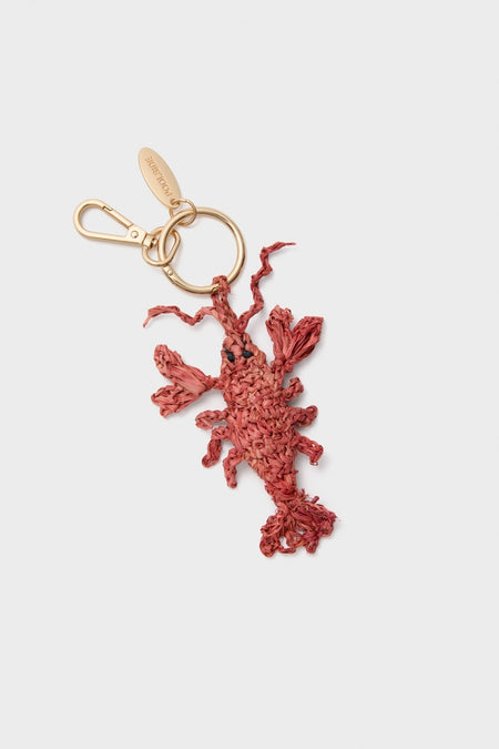 Classic Lobster Raffia Bag Charm features a hand-crocheted lobster design on a gold-tone split ring and clasp with a POOLSIDE tag, adding effortless, high-end fun to your accessories.