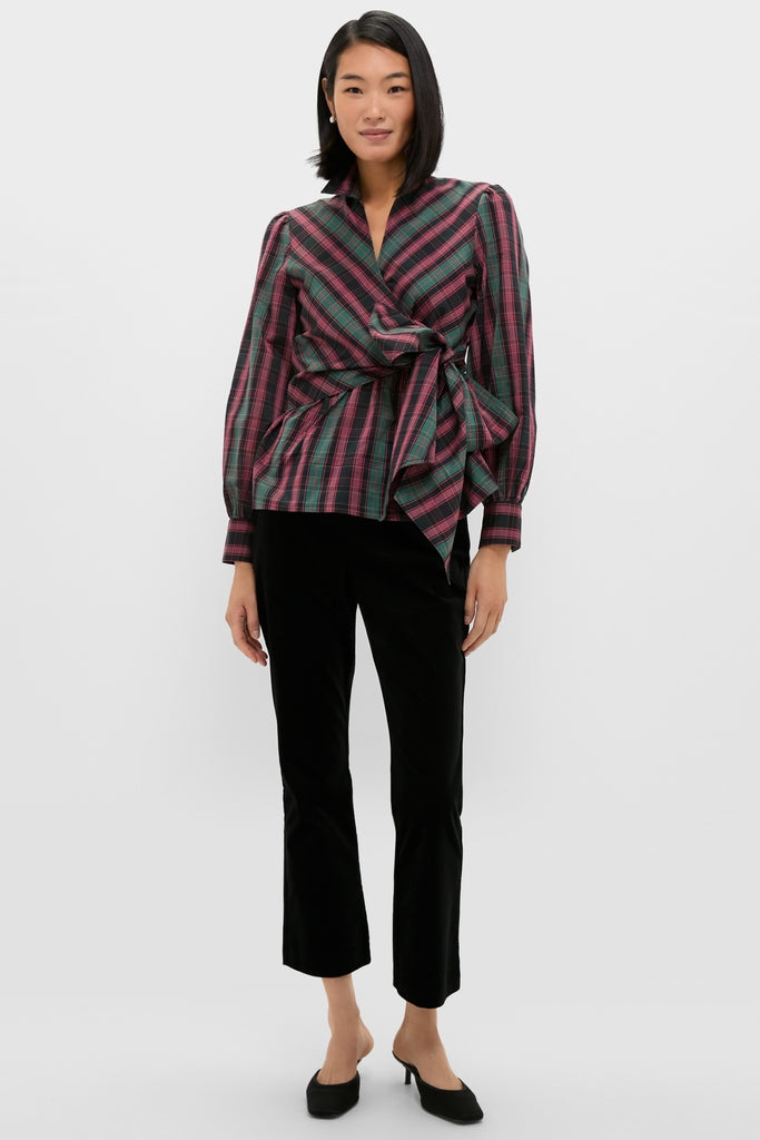 Model wearing the Tartan Tie Front Bow Bea Blouse, a classic wrap-style top with a self-tie bow, exuding effortless, high-end style, paired with sleek black pants.