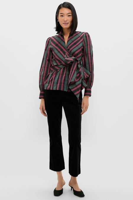Model wearing the Tartan Tie Front Bow Bea Blouse, a classic wrap-style top with a self-tie bow, exuding effortless, high-end style, paired with sleek black pants.