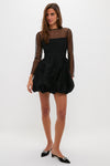 Black Saoirse Mini Dress with a textured bubble skirt and dotted mesh sleeves, exuding a classic, effortless, and fun high-end style for any party occasion.