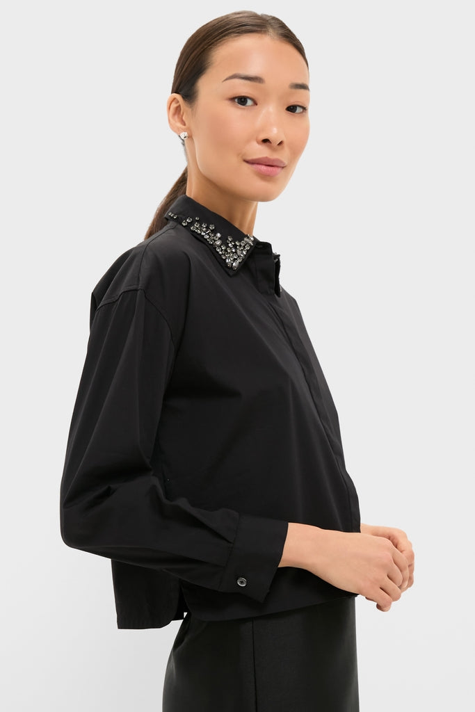Woman models a classic Black Embellished Cropped Jasper Button Down, showcasing its jeweled collar and effortless, high-end style with button cuffs and cropped fit.