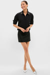 Model in Black Embellished Cropped Jasper Button Down with crystal-collared elegance, rolled sleeves, paired with a skirt and metallic heels for a classic, effortless look.