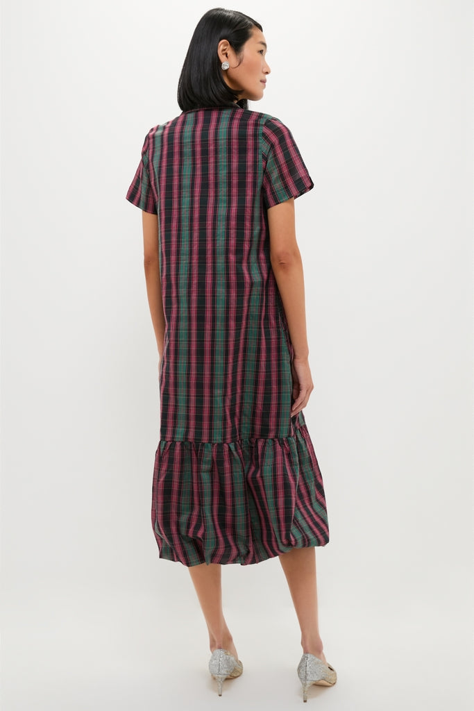 The Tartan Martine Maxi Bubble Dress features a classic plaid pattern with an effortless bubble hem, perfectly styled with sparkly heels for a fun, high-end look.