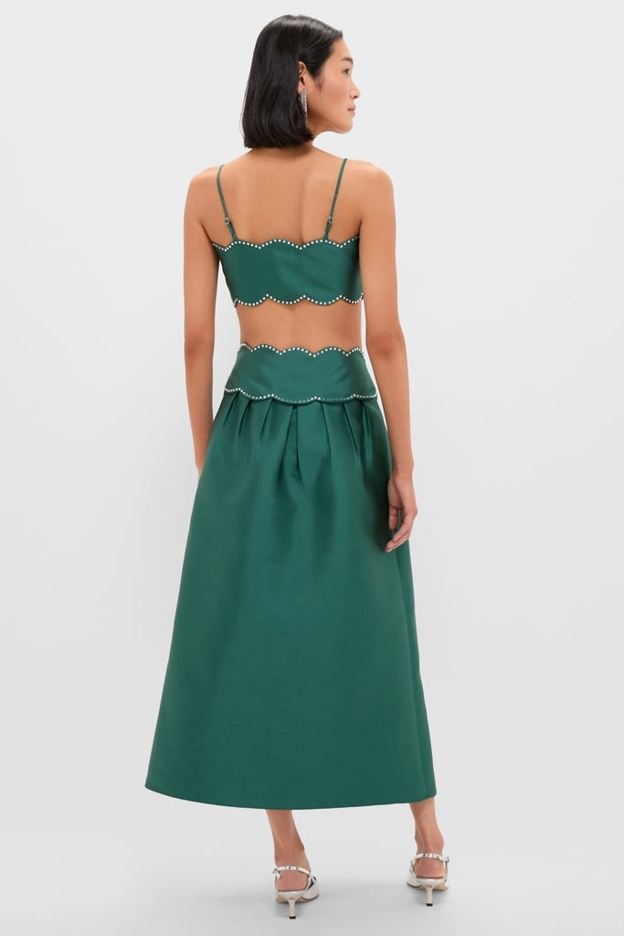 Woman in an elegant, effortless Evergreen Tashi Two Piece Maxi Dress with scalloped rhinestone details, paired with classic white strappy heels, exuding high-end, fun style.