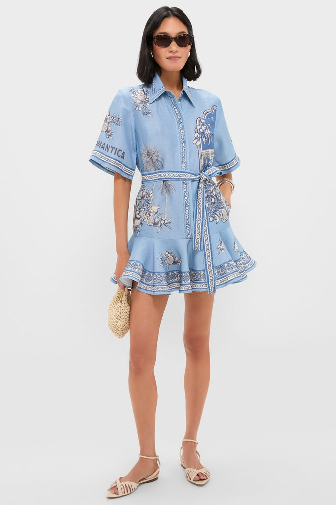 Model wearing Blue Villa Romantica Mini Dress with self-tie waist and flared hem, paired with chic sunglasses and accessories, exuding an effortless, high-end, and fun look.