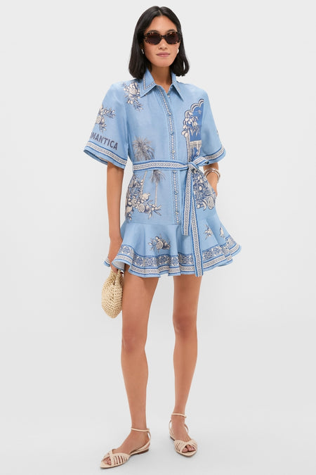 Model wearing Blue Villa Romantica Mini Dress with self-tie waist and flared hem, paired with chic sunglasses and accessories, exuding an effortless, high-end, and fun look.