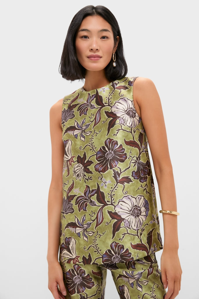 Woman models the classic Multi Citron Top, featuring an effortless floral print and relaxed silhouette, paired with matching pants for a high-end, fun look.