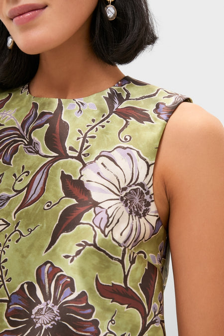 Woman in a classic, sleeveless Multi Citron Top with high neck, displaying an effortless floral print in muted green, perfect for fun and high-end styling.