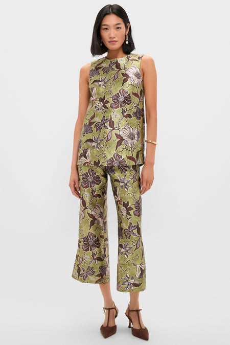 Model wearing the classic, effortless Multi Citron Top with a floral print, styled with matching pants and heels, exuding a fun, high-end fashion vibe.