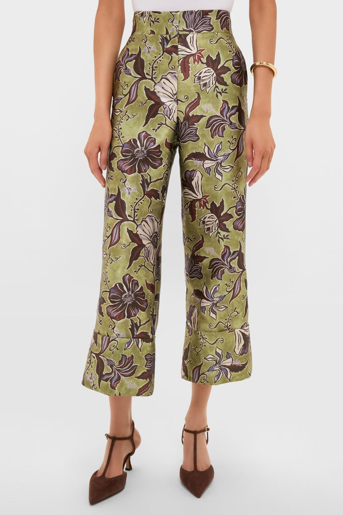 Model wearing classic Multi Citron Pants with floral print, showcasing an effortless high-end style. Paired with brown T-strap heels and a glimpse of a white top.