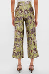 Model showcases the Multi Citron Pants, featuring a classic, high-waisted, wide-leg cropped design with a fun floral print, styled effortlessly with a white top and heels.