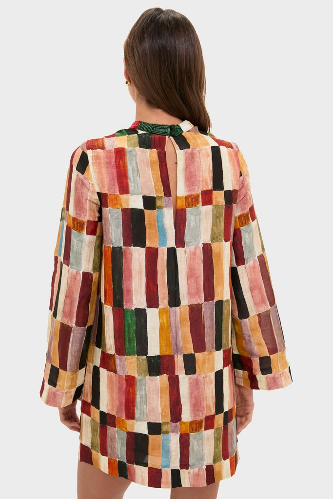 Woman in a classic, effortless Multi Marjorelle Mini Dress with relaxed silhouette and beaded neckline, embodying high-end, fun fashion.