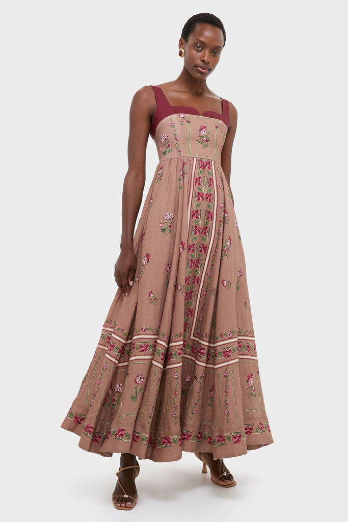 Model in the classic Quebrada Jaspe Maxi Dress with fun floral embroidery, an effortless square neckline, and high-end A-line silhouette, embodying confidence and style.