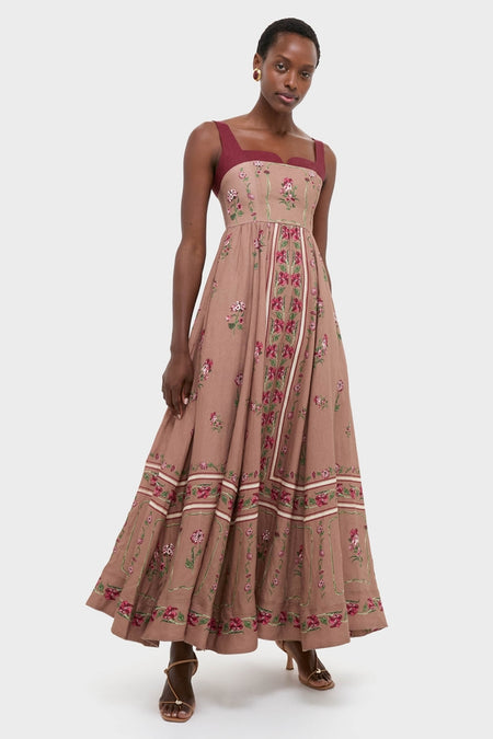 Model in the classic Quebrada Jaspe Maxi Dress with fun floral embroidery, an effortless square neckline, and high-end A-line silhouette, embodying confidence and style.
