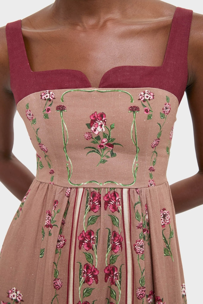 Quebrada Jaspe Maxi Dress: classic sleeveless design with floral embroidery, square neckline, and burgundy straps, embodying effortless elegance for any high-end celebration.