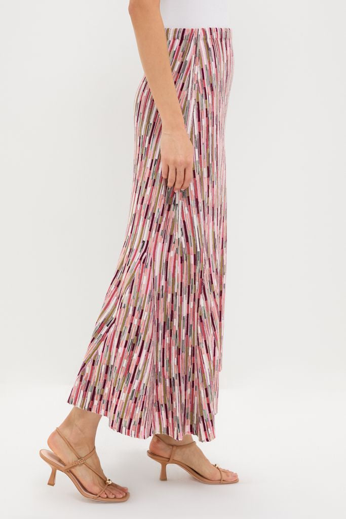 Rosewood Marceline Skirt, a classic and effortless A-line midi with vibrant stripes, elastic waistband, and high-end knit, paired with nude strappy sandals.