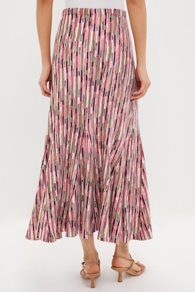 The Rosewood Marceline Skirt showcases a classic, effortless style with its vibrant, pleated design and comfortable elastic waistband, perfect for a fun, high-end look.