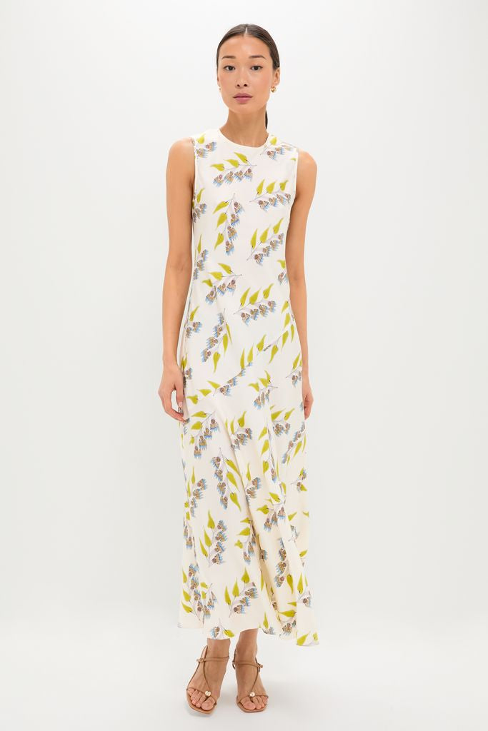 Model wearing the Infinite Flower Gaea Dress, a classic, high-end silk twill maxi with effortless floral print; styled with tan sandals for a fun, sophisticated look.