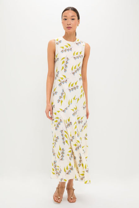 Model wearing the Infinite Flower Gaea Dress, a classic, high-end silk twill maxi with effortless floral print; styled with tan sandals for a fun, sophisticated look.