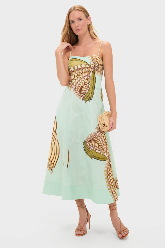 Water Blossoms Vesela Dress: A classic, effortless mint-green midi dress with abstract shell motifs, paired with a fun woven clutch and high-end lace-up stiletto sandals.