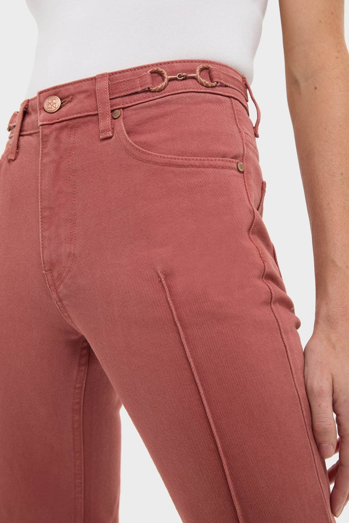 Woman wearing Garden Rose Agatha Jean, showcasing classic high-waisted denim with front pockets, belt loops, and center seam, paired effortlessly with a tucked-in white top.