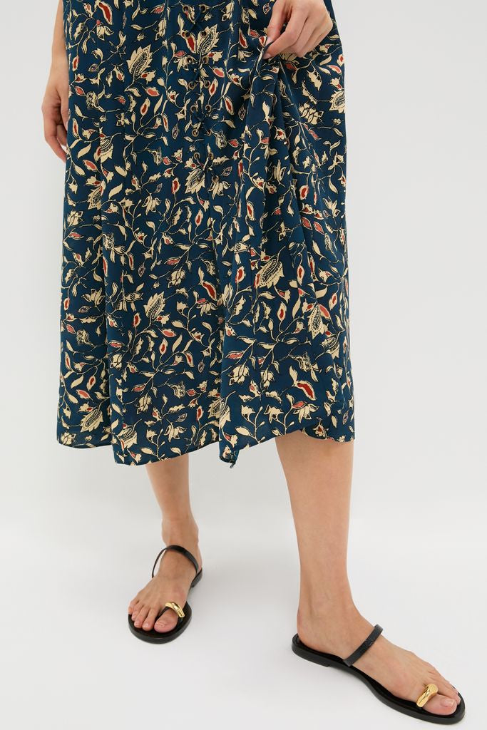 Wearing the classic Midnight Garden Carina Dress, this look is effortlessly high-end with fun floral vines and simple black sandals, perfect for any occasion.
