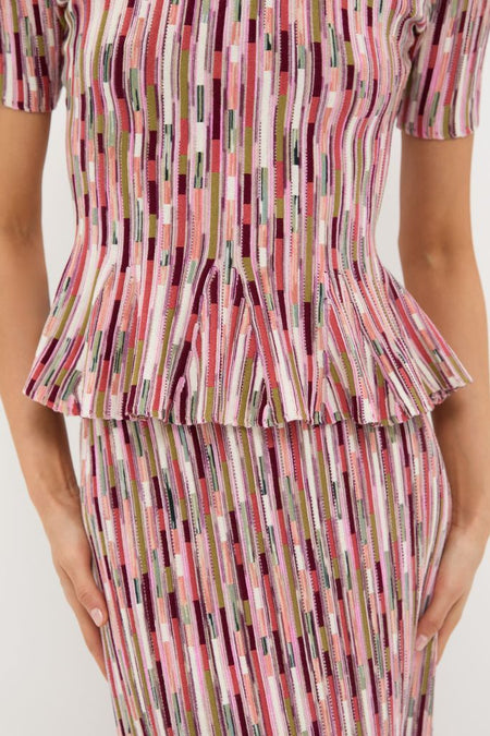 Rosewood Samira Pullover: A classic, high-end knit set with effortless style, featuring a fitted bodice and peplum flare, capturing Tuckernuck's fun and confident aesthetic.